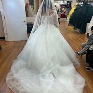 Elegant White Wedding Gown with Beaded Details